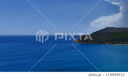 Tranquil Coastline with Clear Blue Sea Tranquil Coastline with Clear Blue Sea 119849412