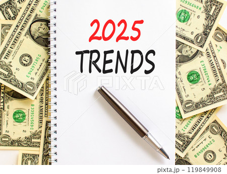 Planning 2025 trends new year symbol. Concept words 2025 Trends on beautiful white note. Beautiful background from dollar bills. Black pen. Business 2025 trends new year concept. Copy space. Planning 2025 trends new year symbol. Concept words 2025 Trends on beautiful white note. Beautiful background from dollar bills. Black pen. Business 2025 trends new year concept. Copy space. 119849908