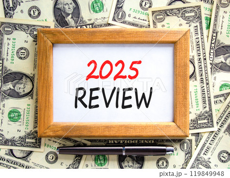 Planning 2025 review new year symbol. Concept words 2025 Review on beautiful wooden picture frame. Beautiful background from dollar bills. Black pen. Business 2025 review new year concept. Copy space. Planning 2025 review new year symbol. Concept words 2025 Review on beautiful wooden picture frame. Beautiful background from dollar bills. Black pen. Business 2025 review new year concept. Copy space. 119849948