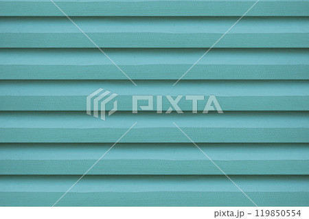 The green wooden vent lattice, serves as a vibrant background. 119850554