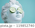 Statue of a Greek goddess with cucumber slices on eyes. Sculpture on spa treatments after bath. Beauty procedures, self-care, art, wellness, cosmetics and beauty salon, relaxation concept 119852740