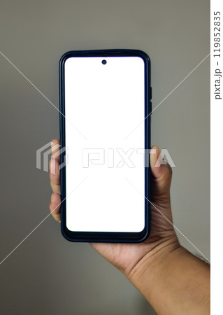 Hand Holding Smartphone With Blank White Screen Display 119852835