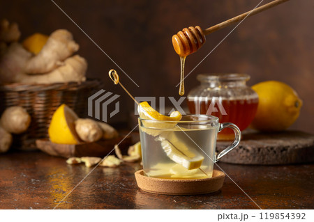 Ginger tea with lemon and honey. 119854392