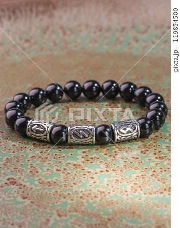 Black Obsidian stone bracelet , Chinese men's modern retro style fashion. Isolated on white background 119854500
