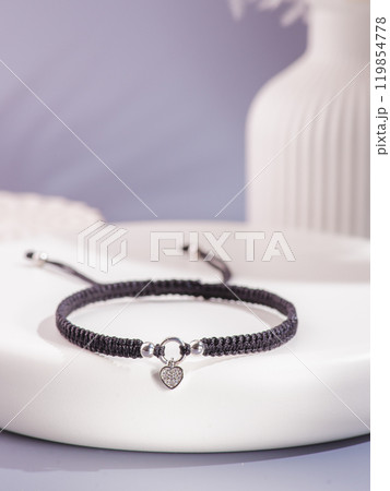 Woman's wrist wearing orange agate bracelet, isolated on white background. Woman's wrist wearing orange agate bracelet, isolated on white background. 119854778