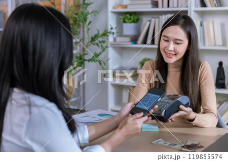 QR code payment, customer using smartphone for paying at shop. Customer paying with qr code on smartphone screen payment technology at shop QR code payment, customer using smartphone for paying at shop. Customer paying with qr code on smartphone screen payment technology at shop 119855574
