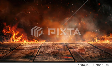 A wood burning fire with smoke and ash in the background 119855930