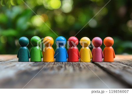 A group of people are standing in a row, each one wearing a different color 119856007