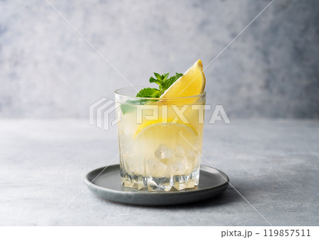 Mojito cocktail with fresh lemon, mint and ice. Refreshing citrus lemonade drink  119857511
