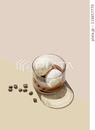 Affogato coffee with vanilla ice cream scoops  and espresso in a glass on a light background 119857770