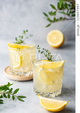 Lemonade drink with fresh lemon, mint and ice. Refreshing citrus mojito cocktail  119857947