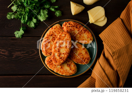 Chvishtari, corn flour tortillas with cheese, pastries, Georgian cuisine, Mchadi, homemade, top view, on a wooden table, no people, 119858231