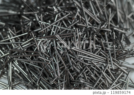 A pile of small iron nails as a background 119859174