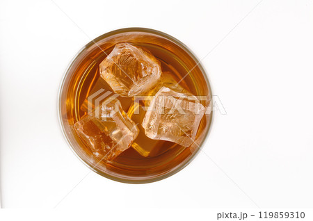 A glass of whisky with ice cubes (top view) 119859310