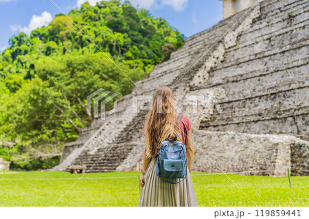 Female tourist exploring the ancient pyramids of Palenque, Mexico, surrounded by dense jungle. Cultural heritage and adventure travel concept Female tourist exploring the ancient pyramids of Palenque, Mexico, surrounded by dense jungle. Cultural heritage and adventure travel concept 119859441