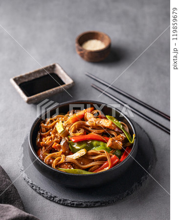 Stir-fry with soba noodles, meat and vegetables. Asian fast and healthy food concept Stir-fry with soba noodles, meat and vegetables. Asian fast and healthy food concept 119859679