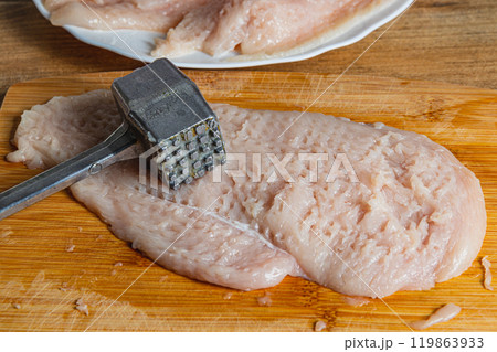 cooking chicken fillet chops for a delicious diet dinner 119863933