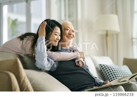 asian elderly father and adult daughter having a good time 119866238