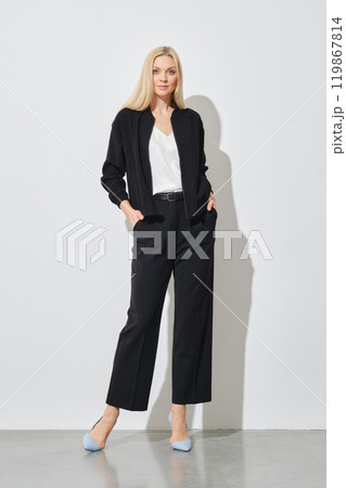 Confident woman in total black outfit 119867814