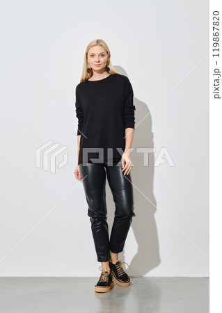 Trendy woman in total black outfit 119867820