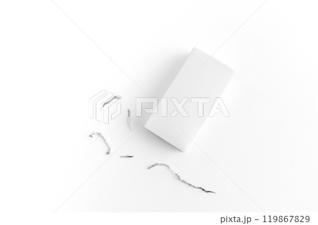 White eraser on a white surface with a few eraser shavings scattered around, emphasizing simplicity and cleanliness. White eraser on a white surface with a few eraser shavings scattered around, emphasizing simplicity and cleanliness. 119867829