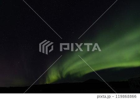 Aurora borealis over in the dark night. The dark sky and filled with stars 119868866