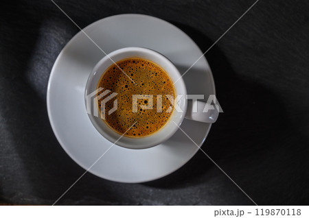 cup of Turkish coffee with foam on a dark background 119870118