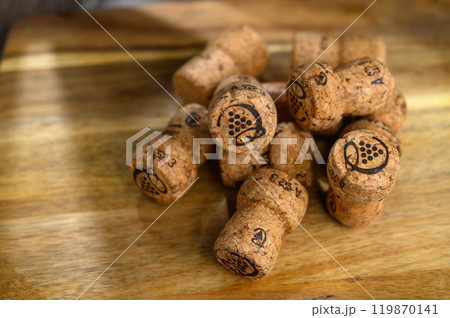 champagne corks on a wooden table champagne corks on a wooden table 119870141