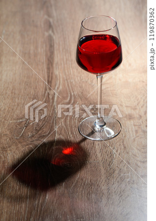 glass of red wine on a wooden table and copy space glass of red wine on a wooden table and copy space 119870362