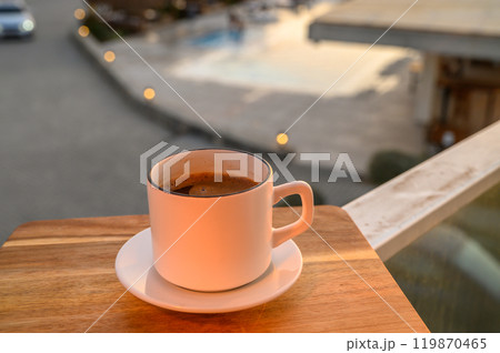 Black coffee in a mug on the background of the pool Black coffee in a mug on the background of the pool 119870465