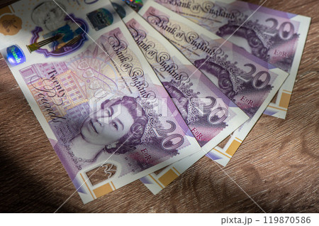 Currency banknotes spread across frame british pound sterling in various denomination Currency banknotes spread across frame british pound sterling in various denomination 119870586