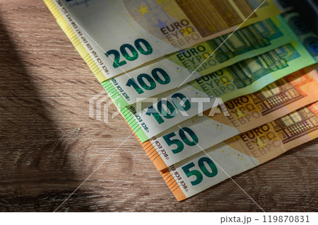 Bundled euro banknotes with selective focus Bundled euro banknotes with selective focus 119870831