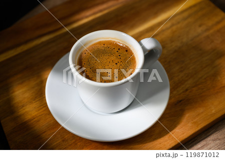 Food background with cup of coffee on wooden table Food background with cup of coffee on wooden table 119871012