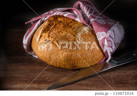 Homemade artisan bread on wood rustic dinner table Homemade artisan bread on wood rustic dinner table 119871014