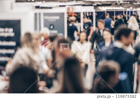 Abstract blurred people at exhibition hall of expo event trade show. Business convention show or job fair. Business concept background 119873382