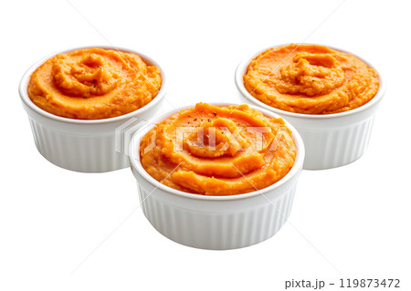 Sweet potato casserole with a crunchy pecan topping in white ceramic dish isolated on white transparent background. Concept of homemade comfort food Thanksgiving Day side dishes Sweet potato casserole with a crunchy pecan topping in white ceramic dish isolated on white transparent background. Concept of homemade comfort food Thanksgiving Day side dishes 119873472