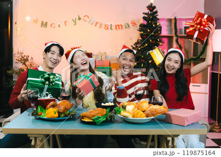Dinner and group of people celebrating together at Merry Christmas and Happy New Year. Dinner and group of people celebrating together at Merry Christmas and Happy New Year. 119875164