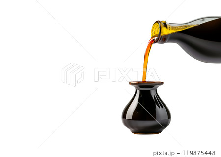 Dark soy sauce poured from bottle isolated on white transparent background. Dark soy sauce poured from bottle isolated on white transparent background. 119875448