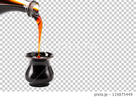 Dark soy sauce poured from bottle isolated on white transparent background. 119875449