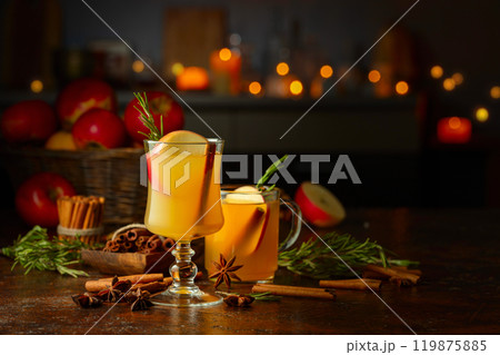 Mulled wine with apple slices, cinnamon, rosemary, and anise. Mulled wine with apple slices, cinnamon, rosemary, and anise. 119875885