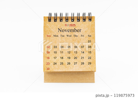 Brown mini desk calendar for November 2025 isolated on white. Brown mini desk calendar for November 2025 isolated on white. 119875973