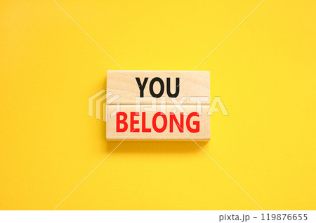 Belonging and you belong symbol. Concept words You belong on beautiful wooden blocks. Beautiful yellow background. Business belonging and you belong concept. Copy space. Belonging and you belong symbol. Concept words You belong on beautiful wooden blocks. Beautiful yellow background. Business belonging and you belong concept. Copy space. 119876655