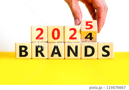 Planning 2025 brands new year symbol. Concept words 2024 Brands to 2025 Brands on beautiful wooden blocks. Beautiful yellow table white background. Business 2025 brands new year concept. Copy space. 119876667