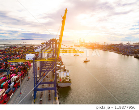 Logistics and transportation of container cargo ship at ship port. Container truck and crane bridge in shipyard. Import export and transport industry. Terminal port for export transport by ship. Logistics and transportation of container cargo ship at ship port. Container truck and crane bridge in shipyard. Import export and transport industry. Terminal port for export transport by ship. 119877956