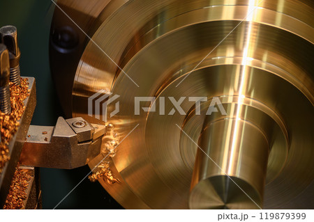 The lathe machine finish cut the brass material parts by lathe tools. 119879399