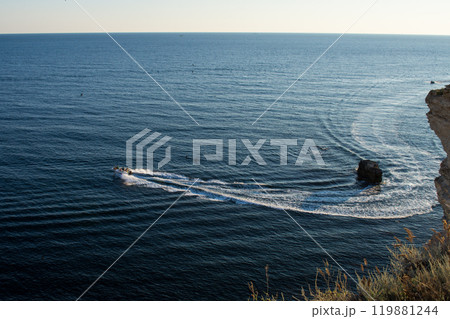 Boat in the waters of the Black Sea along Cape Tarkhankut 119881244