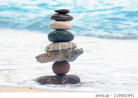 pyramid of stacked stones on the seashore. stabilization and balance in life 119882941