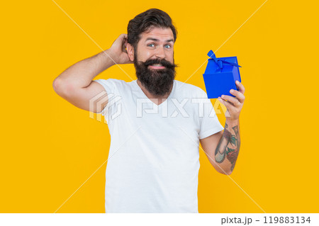 birthday shopping of confused man isolated on yellow background. man on birthday shopping. 119883134
