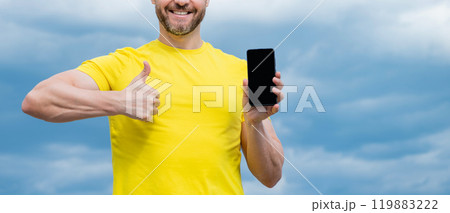 cropped view of man presenting screen of smartphone with copy space. advertisement cropped view of man presenting screen of smartphone with copy space. advertisement 119883222