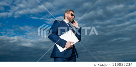 Professional man talking on mobile phone. Successful boss having mobile call 119883234